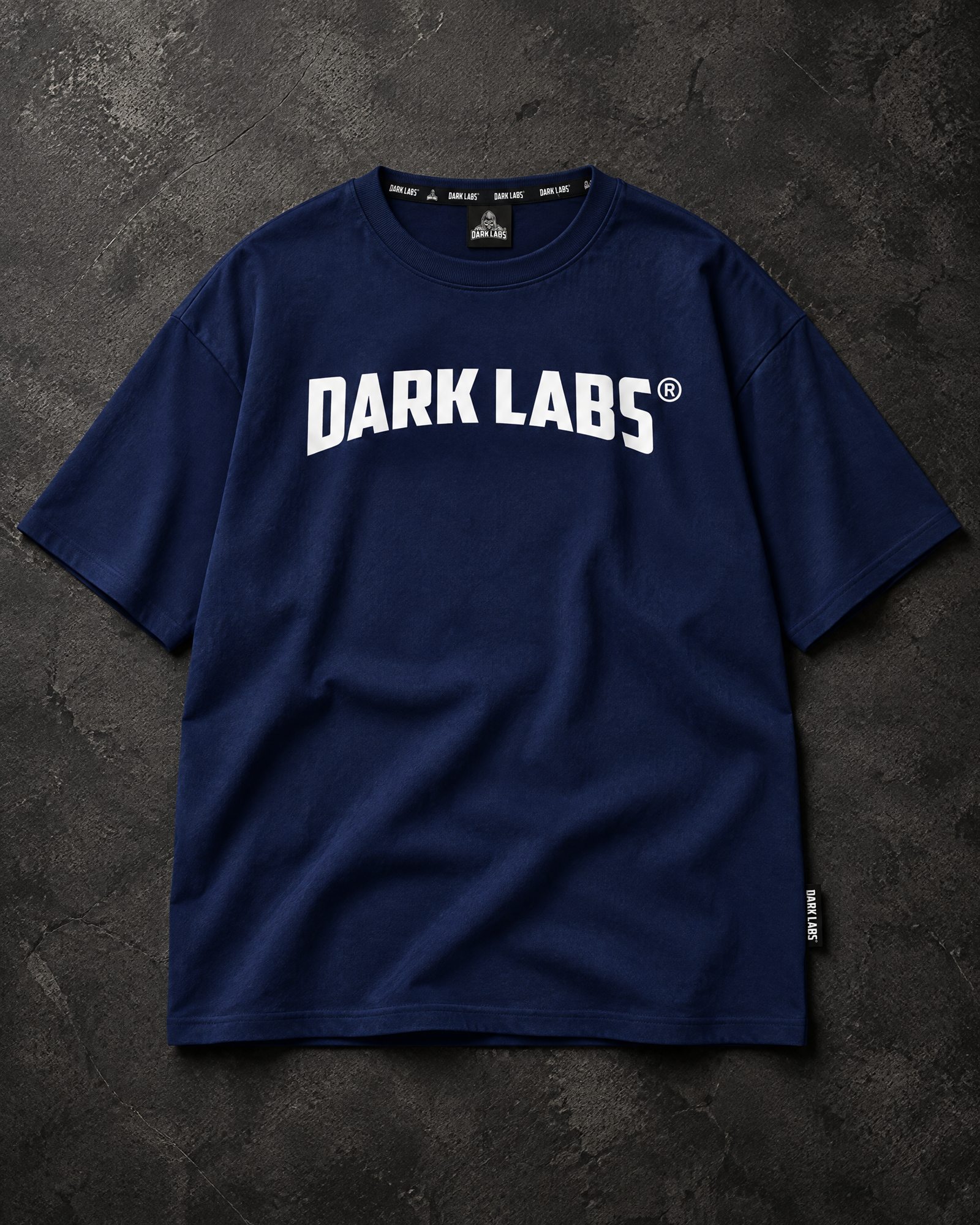 Dark blue oversized Dark Labs T-shirt with white chest logo, flat lay